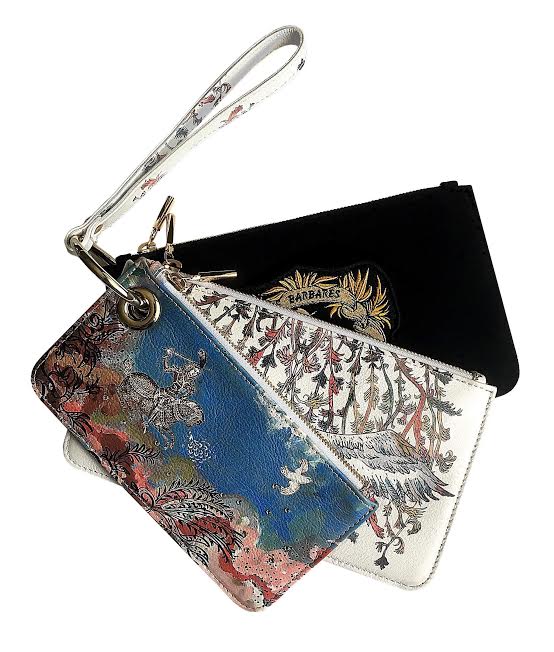 Trio of 3 pouches to mix and match 1 is with various colors printed on blue leather. The other is leaves and wings printed on white leather. The 3rd is black suede with the gold Les Barbares logo embroidered patch