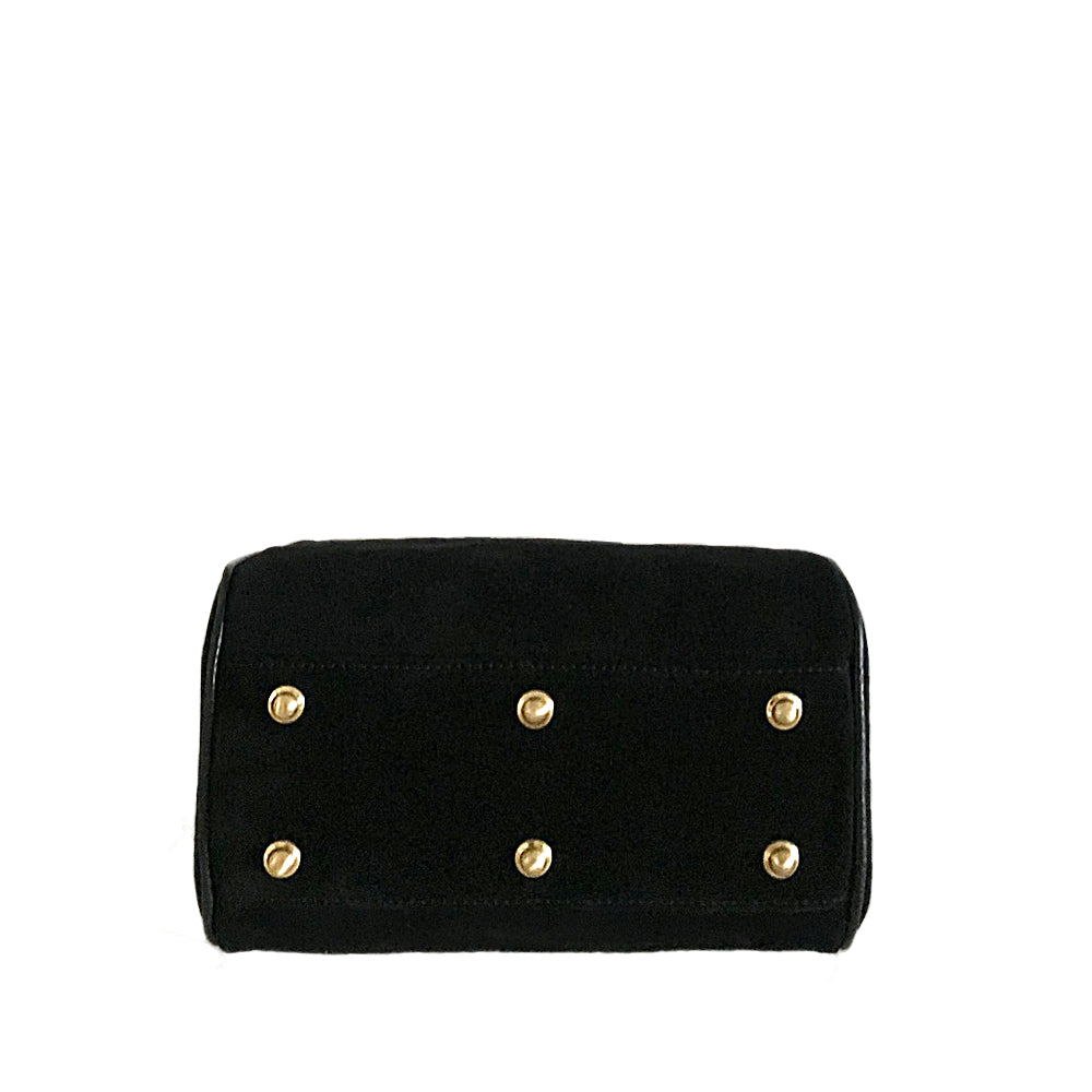 Showing the brass rivets on the bottom of the bag to protect the base
