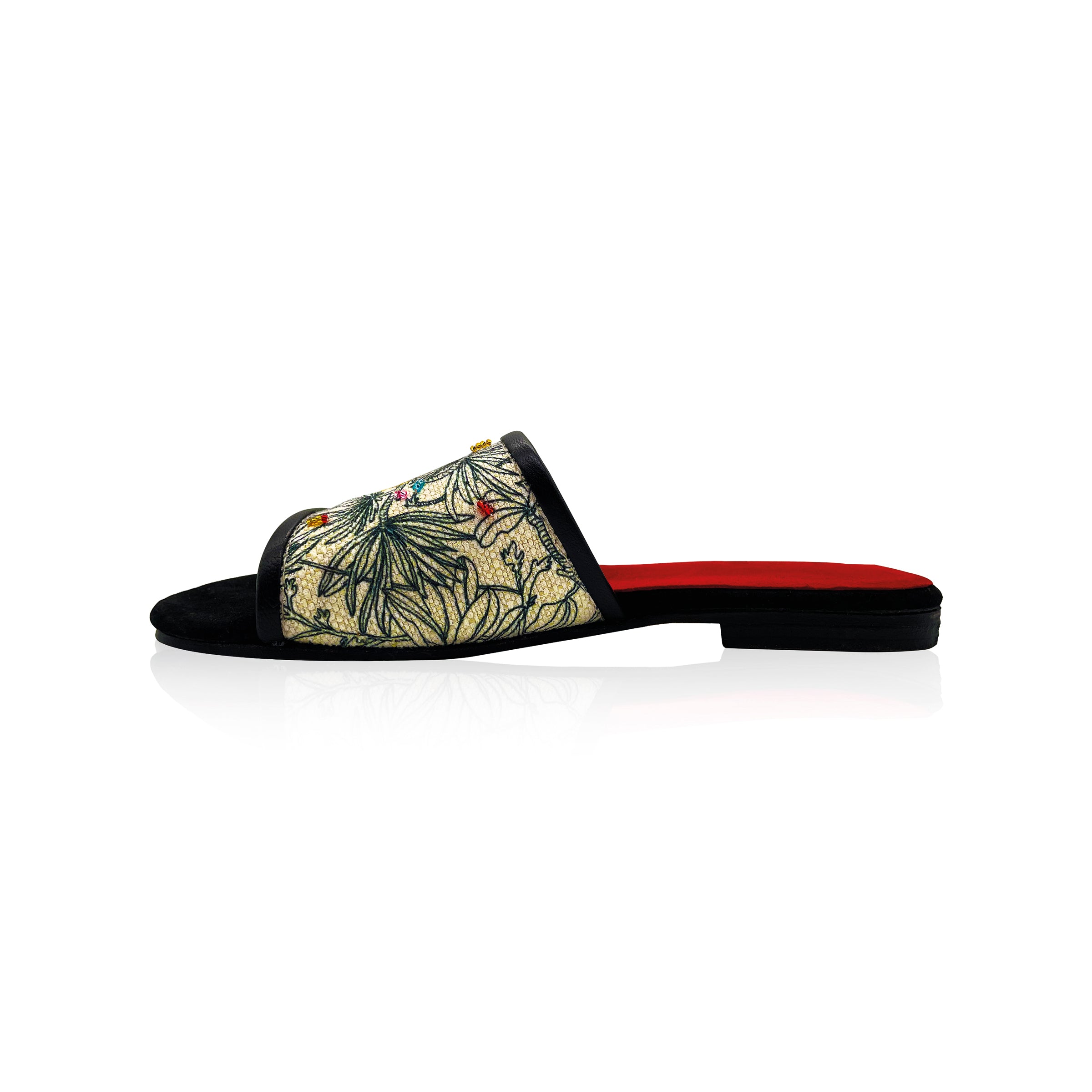 black and white canvas slip on sandals with gold stitching and colored hand embroidered beads. Red leather interior and black leather toes