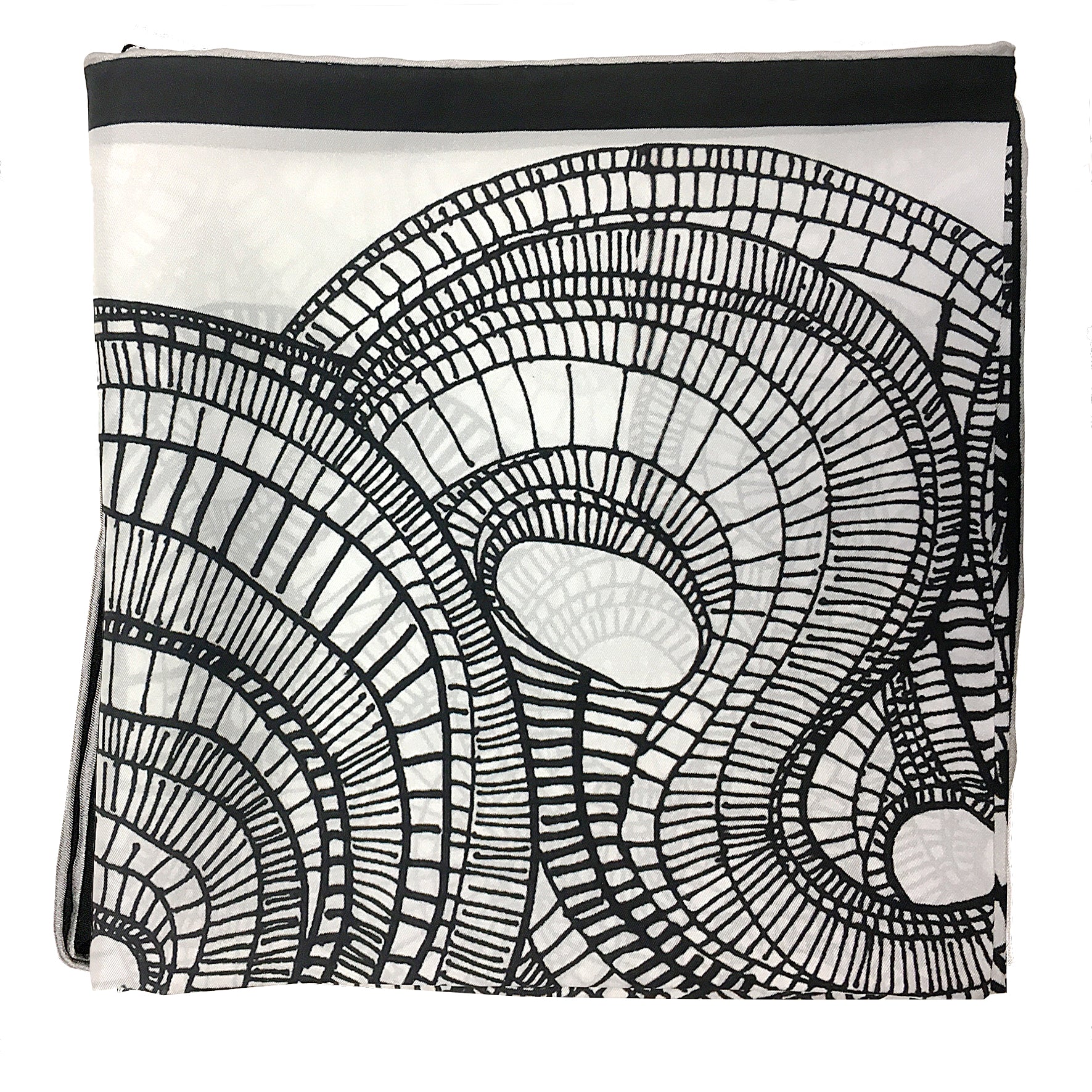 close up of the details of the spirals on the black and white 100% silk scarf