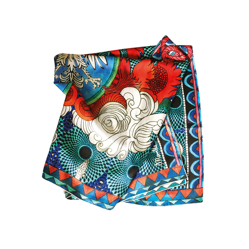 Folded Blue 100% silk scarf with red and pinks and a black and white eagle in the center.